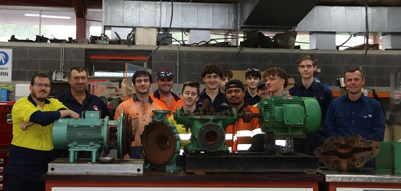 Mr Jones, Mr Holmes and Mr Willocks with a group of engineering apprentices in the TAFE Queensland Automotive and Fitting-Turning workshop